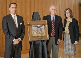 Francine Giani stands next to N. Dale Wright who presented her with a painting. David Hart, director of the Romney Institute, stands on the left. Giani was presented with the 2011 N. Dale Wright Distinguished Alumni Award at a luncheon last Friday.